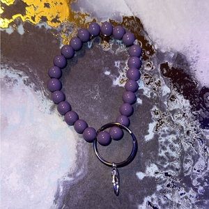 dark purple wristlet holds you’re keys, handsantizer, anything!